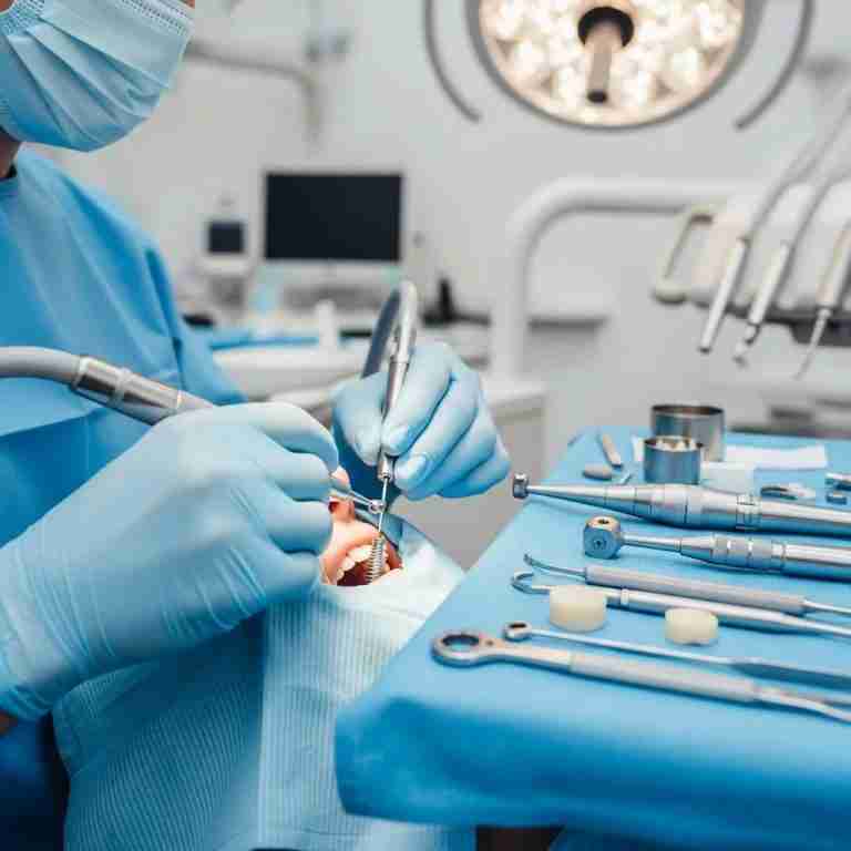 Dental professional performing a dental implant procedure in a modern clinic
